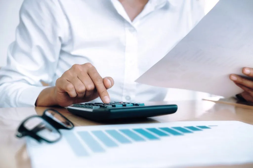 finances saving economy concept female accountant or banker use calculator 1024x683 1920w